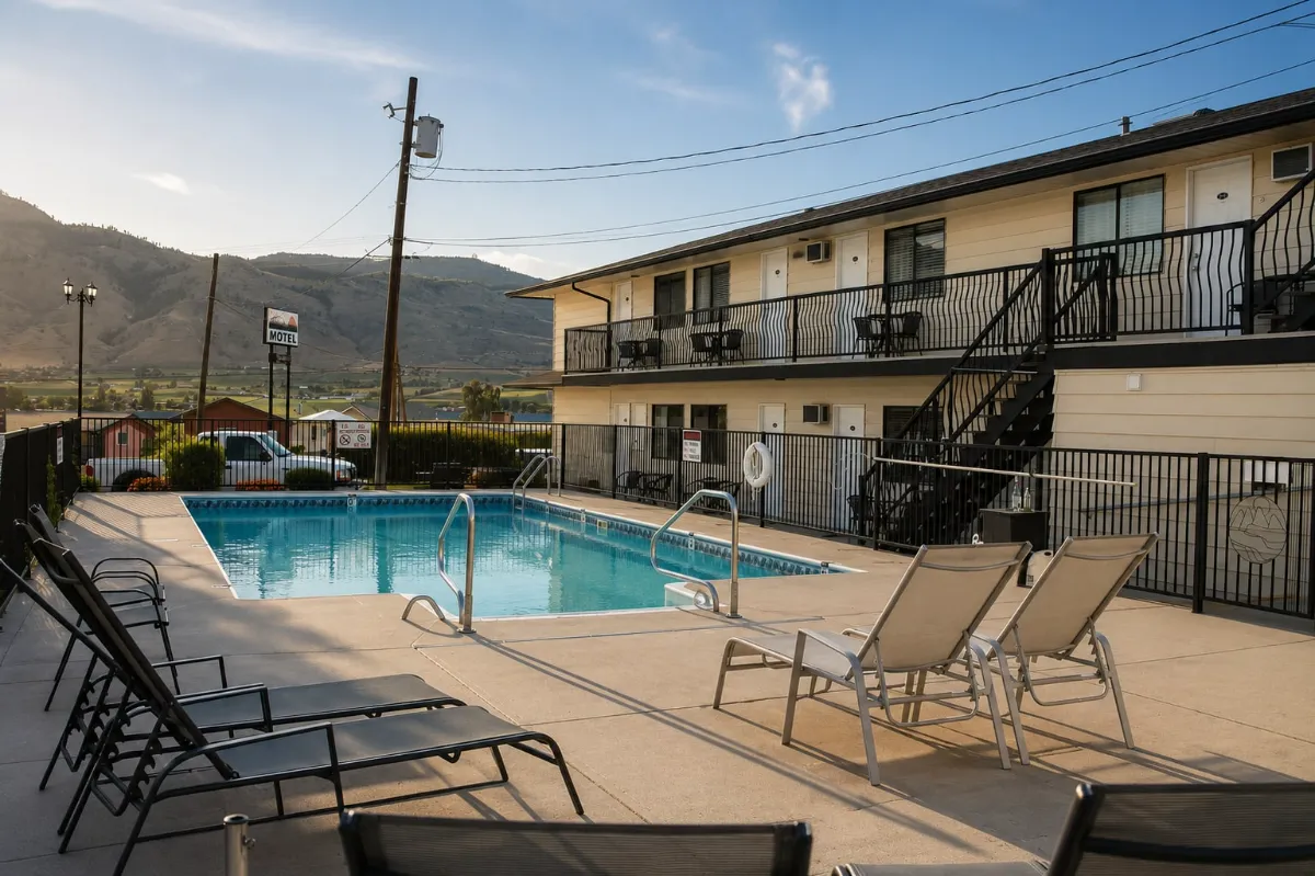Motel pool deck and rooms in Osoyoos — an operating business on lakefront land
